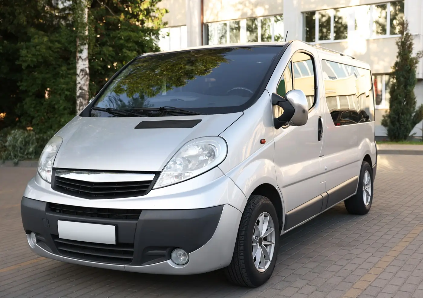 Fleet Black 8-seater passenger minibus with its sliding door open