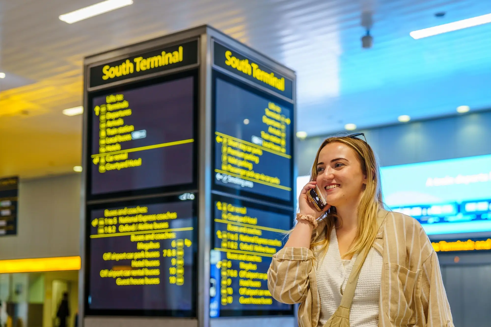 Gatwick Taxi Traveller on the phone in gatwick south terminal