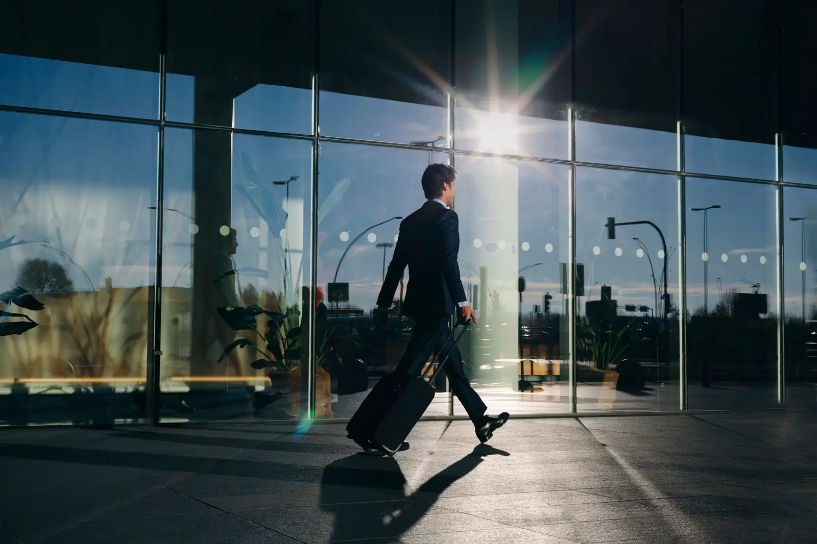 Heathrow Taxi Woman walking with a wheeled suitcase