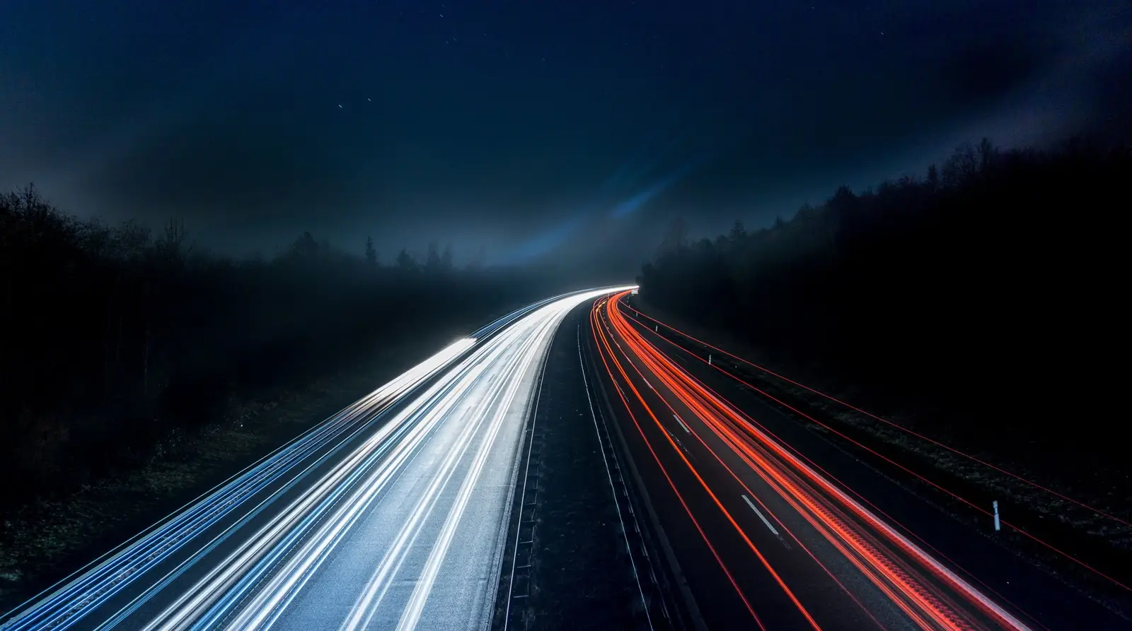 Home Car light trails on a road at night